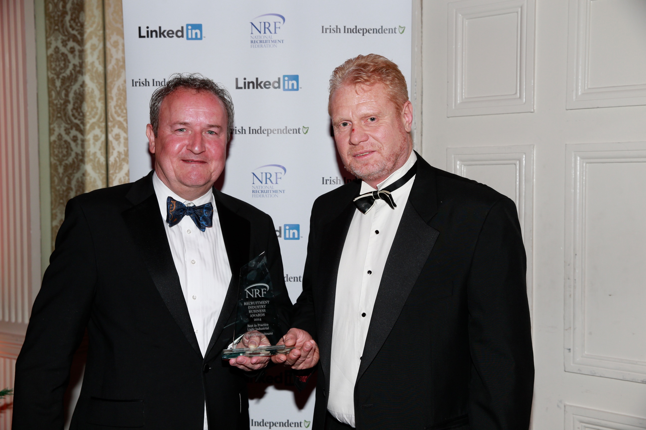 David O'Reilly of O'Reilly Recruitment winner of Best in Practice light industrial accepting his award from Sponsor Les Cooke of Project House