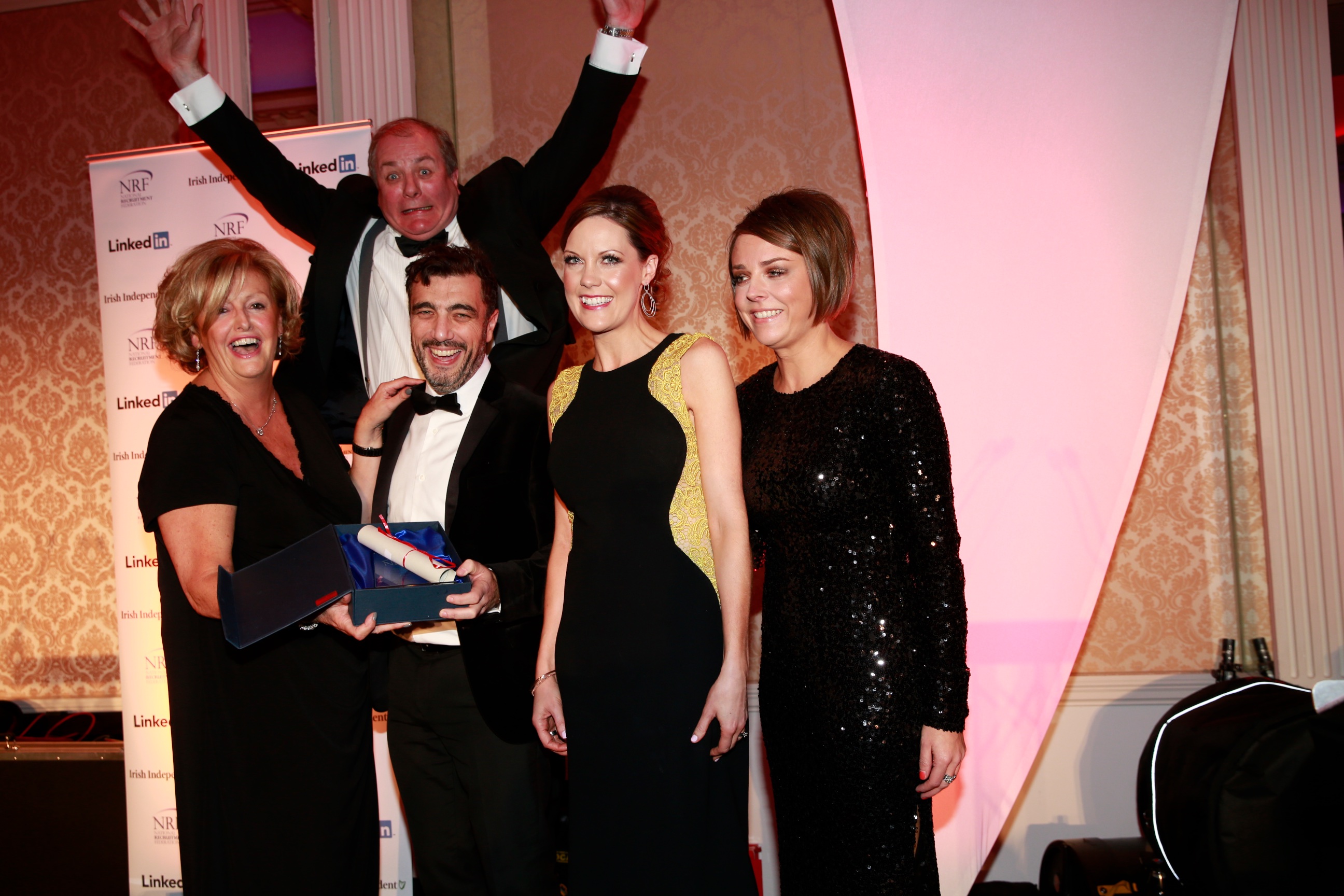 Gavin Duffy MC bombs the photo NRF President Barbara McGrath presents Barry Practor Paula McDonnel and Helen Schofield from TTM with the Best in Healthcare award
