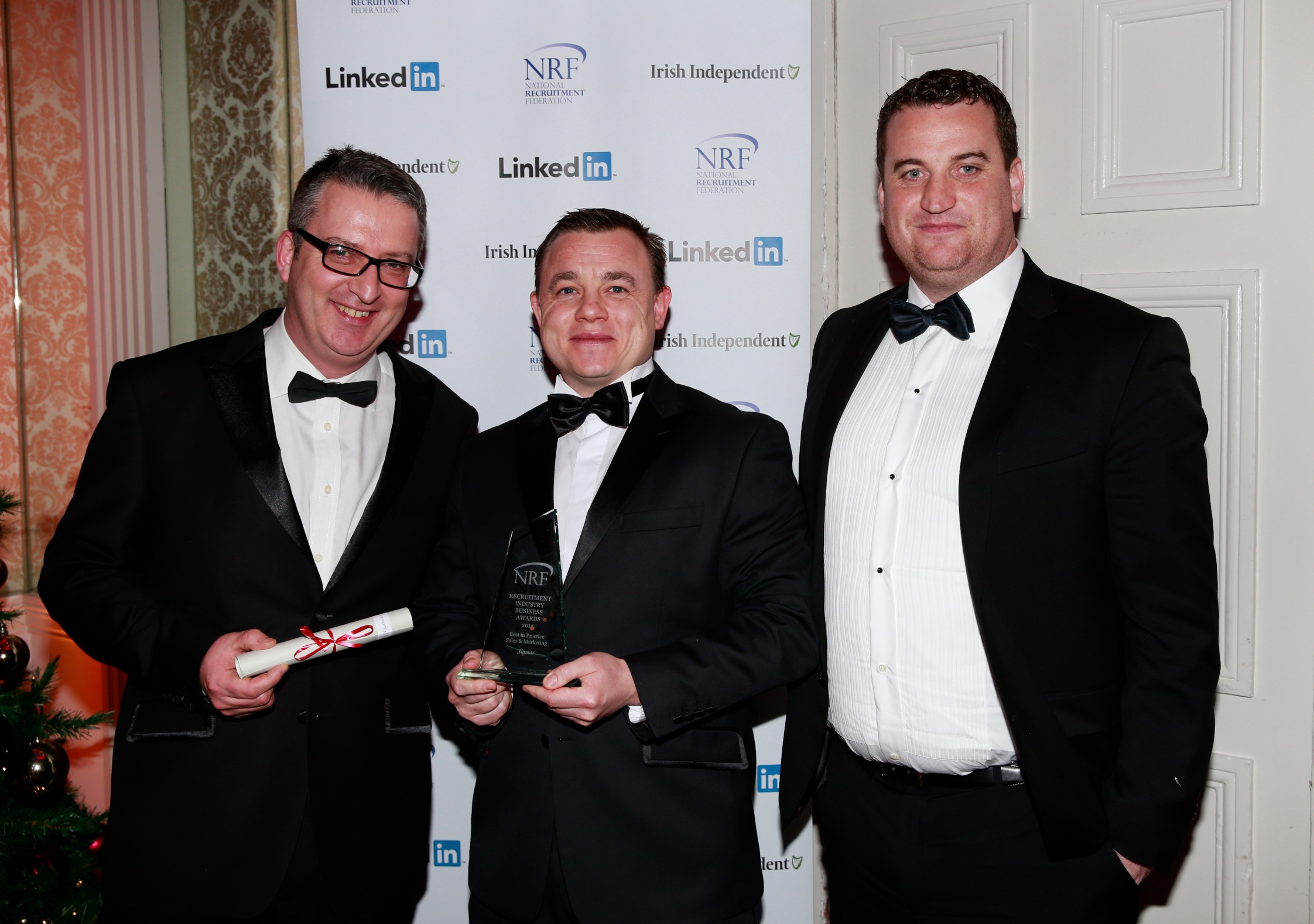 Roger Duffy and Rossa Mulally from Sigmar winners of Sales and Marketing award with sponsor Ruairi Kellegher from Taxback.com