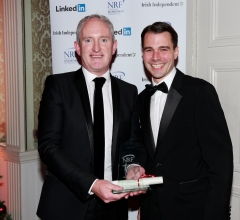 Declan Murphy MD of Servisource winner of Best online Agency accepts the award from James Payne from Bond Adapt sponsors of this category